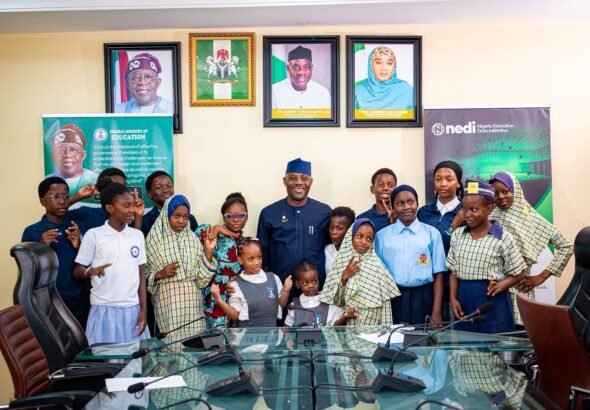Education Minister Maruf Alausa celebrating Children’s Day with children and disability advocate Dera Osadebe in Abuja