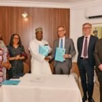 Minister of Livestock Development Idi Mukhtar Maiha and Danish Ambassador Jens Ole Bach Hansen during the signing of the livestock safety pact in Abuja.