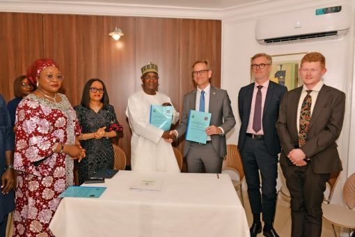 Minister of Livestock Development Idi Mukhtar Maiha and Danish Ambassador Jens Ole Bach Hansen during the signing of the livestock safety pact in Abuja.