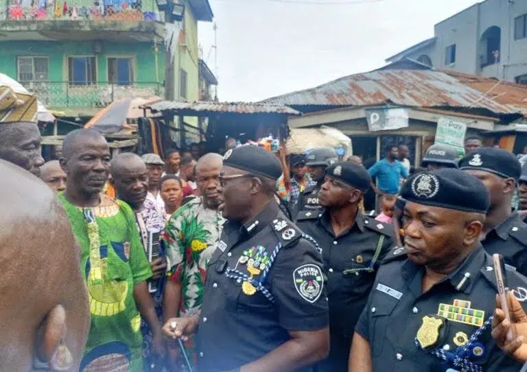 Police officers inspect the scene of a suspected explosion in Mushin, Lagos.