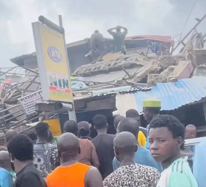 Emergency responders at the scene of a collapsed building in Alakija, Lagos.