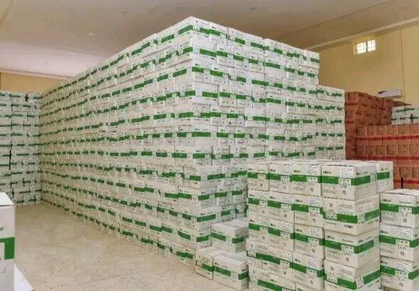Health officials receiving therapeutic food supplies for malnourished children in Gombe State.