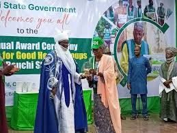 Community members receiving recognition under the Fathers for Good Health initiative in Bauchi