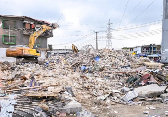 Emergency workers at the scene of the Alakija building collapse in Lagos.