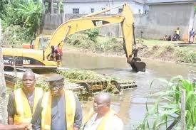 Excavators desilt canals in Yenagoa to reduce flood risks.