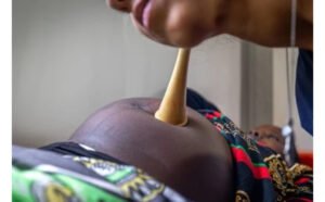 Pregnant woman receiving healthcare services for chronic disease management.