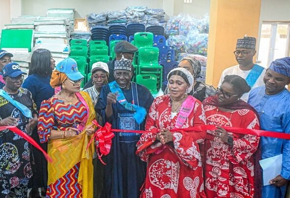 Primary school pupils receive breakfast meals and learning materials during the launch of the School Breakfast Initiative in Lagos.