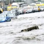 Lagos Environment Commissioner Tokunbo Wahab inspects drainage channels during a flood control assessment in Lagos.