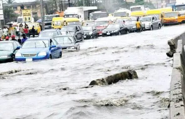 Lagos Environment Commissioner Tokunbo Wahab inspects drainage channels during a flood control assessment in Lagos.