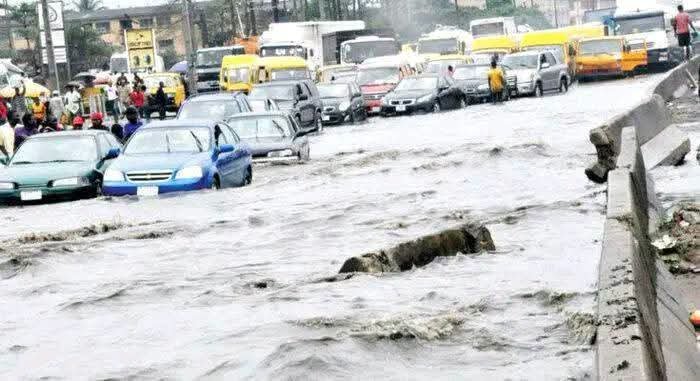 Lagos Environment Commissioner Tokunbo Wahab inspects drainage channels during a flood control assessment in Lagos.