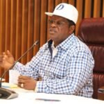 Works Minister David Umahi inspects the Kuramo Lagoon during a flood control assessment in Lagos.