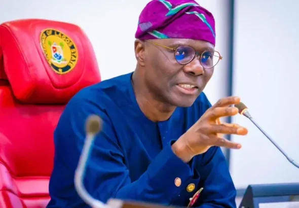 Governor Babajide Sanwo-Olu presenting compensation cheques to affected property owners in Lagos.