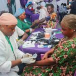 Medical personnel attending to beneficiaries during a free medical outreach in Ota, Ogun State.