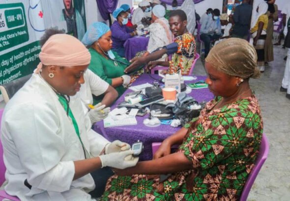 Medical personnel attending to beneficiaries during a free medical outreach in Ota, Ogun State.
