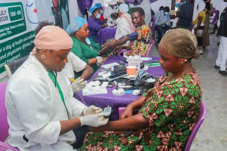 Medical personnel attending to beneficiaries during a free medical outreach in Ota, Ogun State.