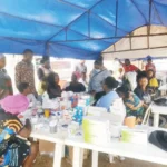 Medical personnel attend to residents during RCCG's free medical outreach in Lagos.