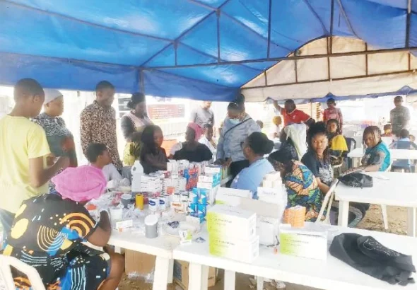 Medical personnel attend to residents during RCCG's free medical outreach in Lagos.