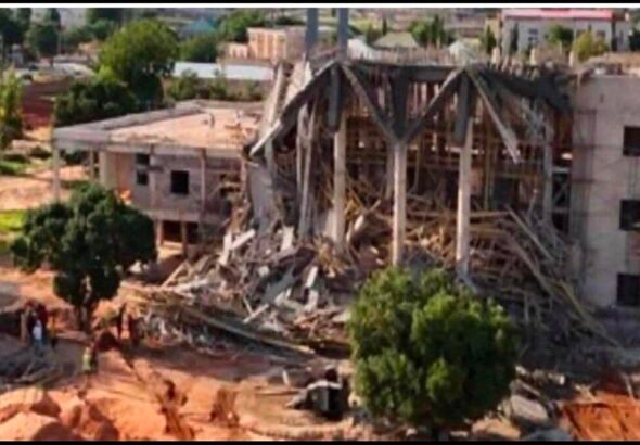 Emergency responders at the collapsed entrance canopy of the new Gombe State House of Assembly complex.