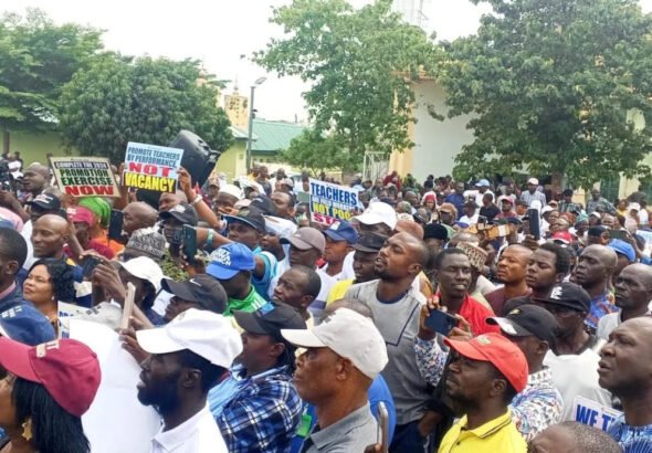 FCT teachers protest promotion policy outside the National Open University in Abuja.