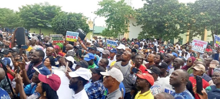 FCT teachers protest promotion policy outside the National Open University in Abuja.