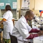 Health workers conducting diagnostic testing at a primary healthcare facility in Africa.