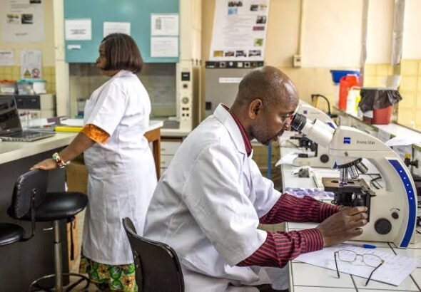 Health workers conducting diagnostic testing at a primary healthcare facility in Africa.