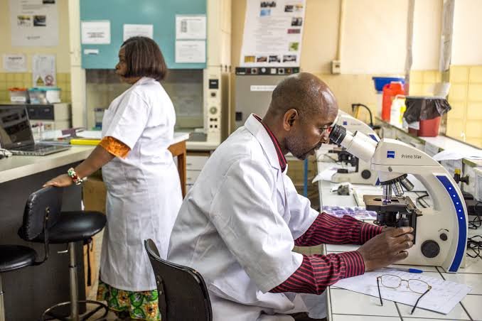 Health workers conducting diagnostic testing at a primary healthcare facility in Africa.