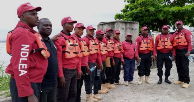 NDLEA officers display seized narcotics during a briefing in Benin City, Edo State.