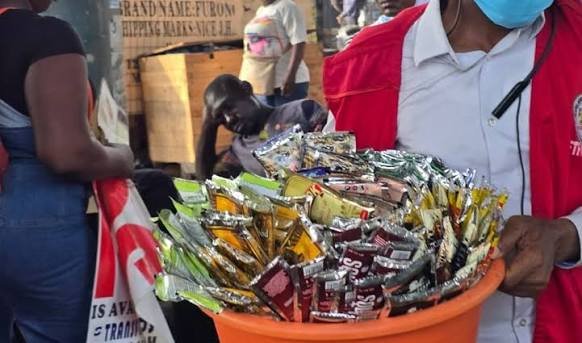 NAFDAC officials inspecting alcoholic beverages during nationwide enforcement.
