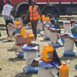 Displaced families receiving relief materials during NEMA's intervention in Taraba State.