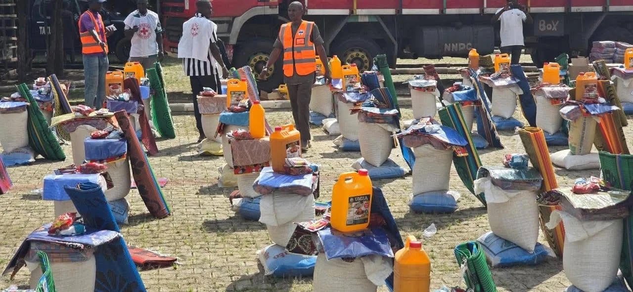 Displaced families receiving relief materials during NEMA's intervention in Taraba State.