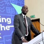 UN Resident Coordinator Mohammed Malick Fall addresses young participants at a health policy forum in Abuja.
