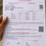 Simbiat Usman displays the Abuja Municipal Area Council (AMAC) tenement rate demand notice issued to her property in Abuja. (Photo: Mirian/AHR)