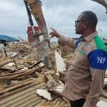 LASEMA officials supervise demolition of illegal structures beneath high-tension power lines in Ikola, Lagos.