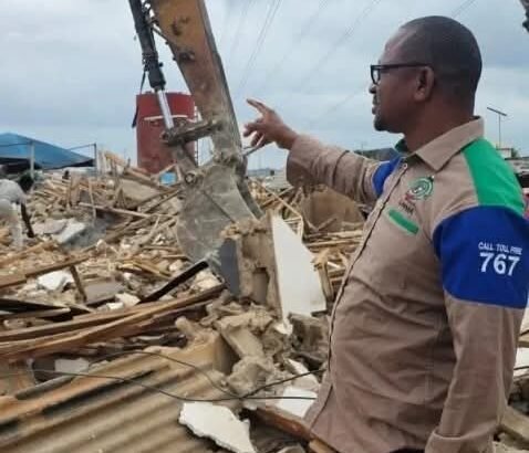 LASEMA officials supervise demolition of illegal structures beneath high-tension power lines in Ikola, Lagos.