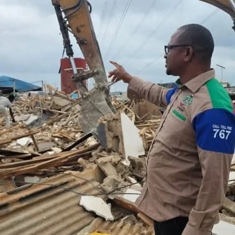 LASEMA officials supervise demolition of illegal structures beneath high-tension power lines in Ikola, Lagos.