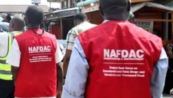 NAFDAC officials inspect alcoholic beverages during enforcement operations.