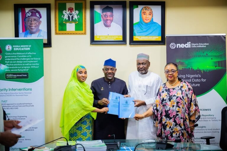 Education Minister Maruf Alausa receives the report on Nigeria's revised agricultural curricula.