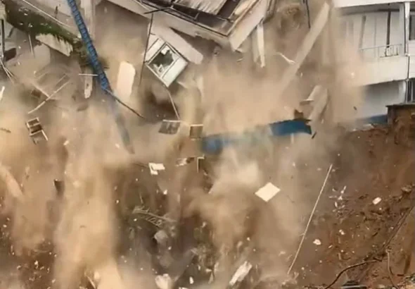 Hospital building collapses into an erosion gully after heavy rainfall in Calabar.