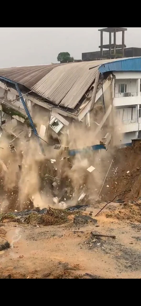 Hospital building collapses into an erosion gully after heavy rainfall in Calabar.