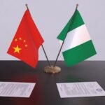 Chinese Ambassador Yu Dunhai meets Nigerian officials in Abuja to announce a development grant.