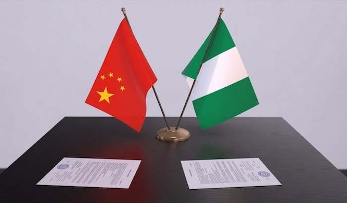 Chinese Ambassador Yu Dunhai meets Nigerian officials in Abuja to announce a development grant.