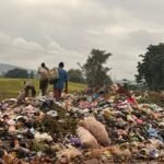 Large roadside refuse dump beside the Nyanya–Keffi Expressway in Karu, Abuja