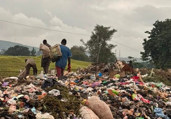 Large roadside refuse dump beside the Nyanya–Keffi Expressway in Karu, Abuja