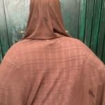 A Nigerian woman recovering after fibroid surgery, highlighting the growing burden of recurring uterine fibroids.