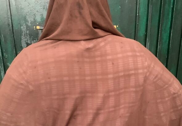 A Nigerian woman recovering after fibroid surgery, highlighting the growing burden of recurring uterine fibroids.