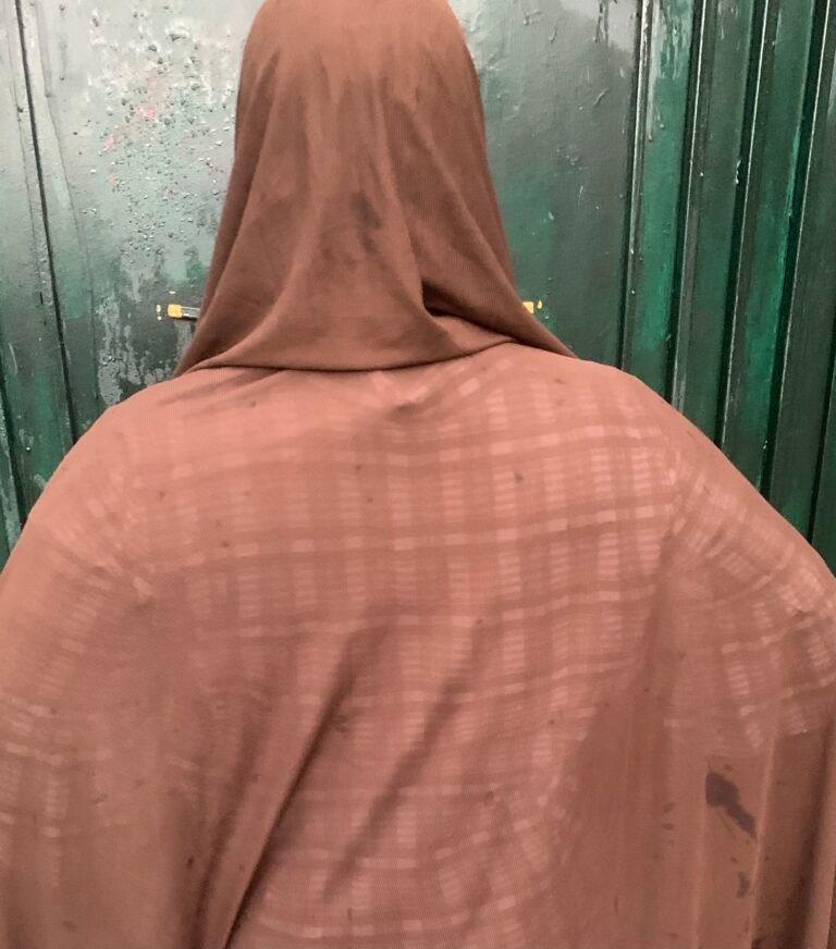 A Nigerian woman recovering after fibroid surgery, highlighting the growing burden of recurring uterine fibroids.