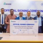 Representatives of Roche Diagnostics and MedServe sign a healthcare partnership agreement in Lagos.