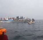 Rescue teams conduct search operations after a ferry capsizes on Lake Kariba.