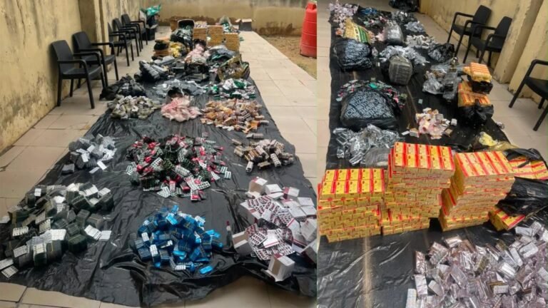 NDLEA operatives display seized cocaine, codeine syrup and cannabis recovered in Lagos.